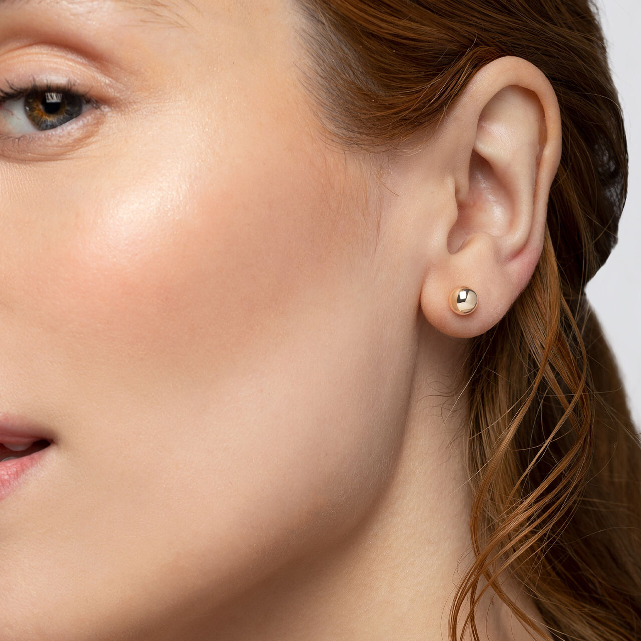 Birks Essentials Yellow Gold Stud Earrings on model image number 1